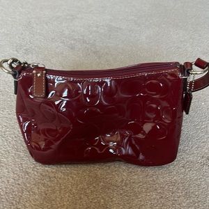 shiny red coach purse